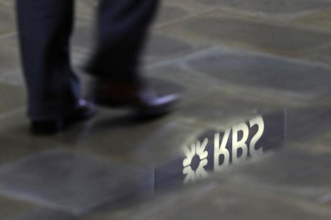 A man walks past a Royal Bank of Scotland branch reflected in a puddle in central London January 14, 2010. REUTERS/Stefan Wermuth A man walks past a Royal Bank of Scotland branch reflected in a puddle in central London January 14, 2010. REUTERS/Stefan Wermuth