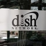 The sign in the lobby of the corporate headquarters of Dish Network is seen in the Denver suburb of Englewood, Colorado April 6, 2011. REUTE The sign in the lobby of the corporate headquarters of Dish Network is seen in the Denver suburb of Englewood, Colorado April 6, 2011. REUTE