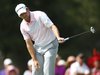 Sergio Garcia of Spain reacts as he watches his putt on the seventh green during the final round of The Players Championship PGA golf tourna