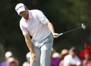 Sergio Garcia of Spain reacts as he watches his putt on the seventh green during the final round of The Players Championship PGA golf tourna