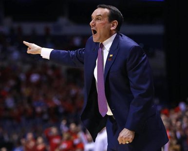 Duke Blue Devils head coach Mike Krzyzewski yells instructions to his team in the first half during their Midwest Regional NCAA men's basket Duke Blue Devils head coach Mike Krzyzewski yells instructions to his team in the first half during their Midwest Regional NCAA men's basket