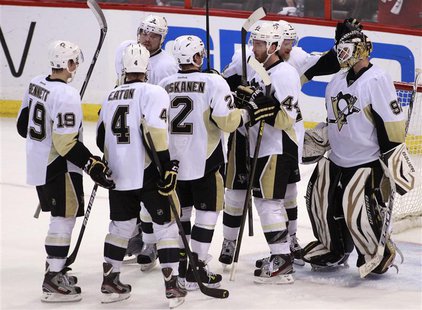 Pittsburgh Penguins goalie Tomas Vokoun (R) is congratulated by teammates after the Penguins defeated the Ottawa Senators in Game 4 of their Pittsburgh Penguins goalie Tomas Vokoun (R) is congratulated by teammates after the Penguins defeated the Ottawa Senators in Game 4 of their