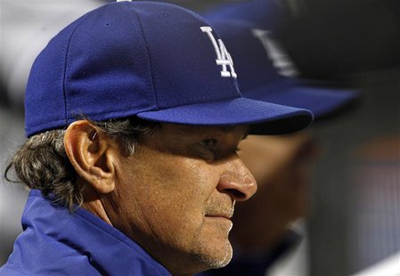 Los Angeles Dodgers manager Don Mattingly looks on against the New York Mets during the fifth inning of their MLB National League baseball g Los Angeles Dodgers manager Don Mattingly looks on against the New York Mets during the fifth inning of their MLB National League baseball g