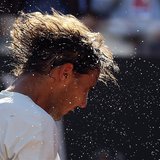Rafael Nadal of Spain shakes the sweat off his hair after winning the men's singles final match against Roger Federer of Switzerland at the Rafael Nadal of Spain shakes the sweat off his hair after winning the men's singles final match against Roger Federer of Switzerland at the