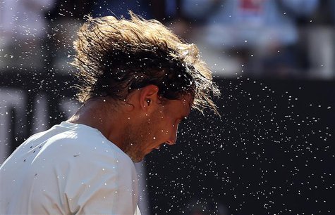 Rafael Nadal of Spain shakes the sweat off his hair after winning the men's singles final match against Roger Federer of Switzerland at the Rafael Nadal of Spain shakes the sweat off his hair after winning the men's singles final match against Roger Federer of Switzerland at the