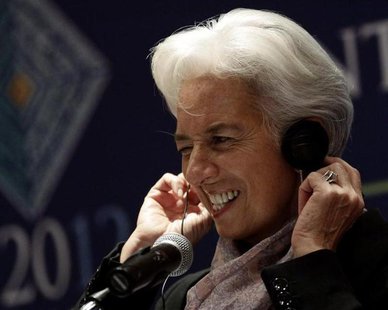 International Monetary Fund (IMF) Managing Director Christine Lagarde adjusts her headphones as she listens to a question on the second day International Monetary Fund (IMF) Managing Director Christine Lagarde adjusts her headphones as she listens to a question on the second day