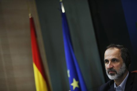 Former leader of the Syrian National Coalition (SNC) Moaz al-Khatib attends a joint news conference with Spanish Foreign Minister Jose Manue Former leader of the Syrian National Coalition (SNC) Moaz al-Khatib attends a joint news conference with Spanish Foreign Minister Jose Manue
