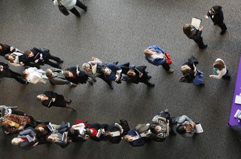 Hundreds of job seekers wait in line with their resumes to talk to recruiters (R) at the Colorado Hospital Association health care career fa Hundreds of job seekers wait in line with their resumes to talk to recruiters (R) at the Colorado Hospital Association health care career fa