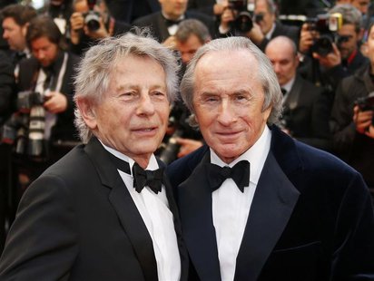 Director Roman Polanski (L) and former Formula One champion driver Jackie Stewart of Britain pose on the red carpet as they arrive for the s Director Roman Polanski (L) and former Formula One champion driver Jackie Stewart of Britain pose on the red carpet as they arrive for the s