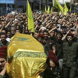 Supporters of Hezbollah and relatives of Hezbollah member Hussein Ahmad Abu Hasan carry his coffin during his funeral in Beirut's suburbs Ma Supporters of Hezbollah and relatives of Hezbollah member Hussein Ahmad Abu Hasan carry his coffin during his funeral in Beirut's suburbs Ma