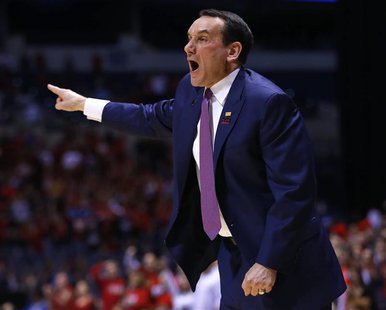 Duke Blue Devils head coach Mike Krzyzewski yells instructions to his team in the first half during their Midwest Regional NCAA men's basket Duke Blue Devils head coach Mike Krzyzewski yells instructions to his team in the first half during their Midwest Regional NCAA men's basket