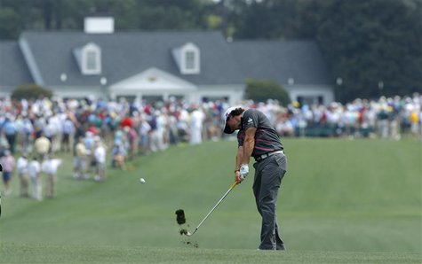 Rory McIllroy of Northern Ireland hits his approach shot to the first green during a practice round for the 2012 Masters Golf Tournament at Rory McIllroy of Northern Ireland hits his approach shot to the first green during a practice round for the 2012 Masters Golf Tournament at