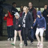 Mourners leave the first memorial service for a child killed by the tornado that struck Plaza Towers elementary school in Oklahoma City, May