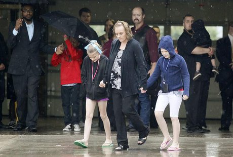 Mourners leave the first memorial service for a child killed by the tornado that struck Plaza Towers elementary school in Oklahoma City, May Mourners leave the first memorial service for a child killed by the tornado that struck Plaza Towers elementary school in Oklahoma City, May