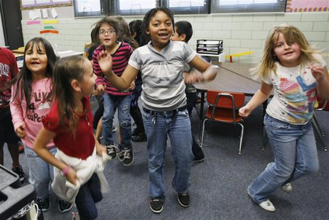 Students at Rose Hill Elementary School jump around doing a counting exercise that is also aerobic exercise in their classroom in Commerce C Students at Rose Hill Elementary School jump around doing a counting exercise that is also aerobic exercise in their classroom in Commerce C