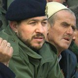 A file photo shows senior ex-commander of the Kosovo Liberation Army (KLA), Sami Lushtaku (L) during a reburial ceremony at village of Likos A file photo shows senior ex-commander of the Kosovo Liberation Army (KLA), Sami Lushtaku (L) during a reburial ceremony at village of Likos