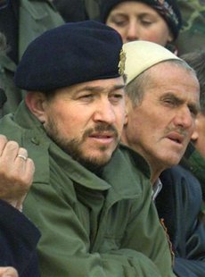 A file photo shows senior ex-commander of the Kosovo Liberation Army (KLA), Sami Lushtaku (L) during a reburial ceremony at village of Likos A file photo shows senior ex-commander of the Kosovo Liberation Army (KLA), Sami Lushtaku (L) during a reburial ceremony at village of Likos