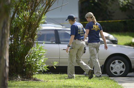 FBI personnel walk through the complex surrounding the apartment, where Ibragim Todashev was shot and killed by FBI, in Orlando, Florida, Ma FBI personnel walk through the complex surrounding the apartment, where Ibragim Todashev was shot and killed by FBI, in Orlando, Florida, Ma