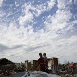 Justin Stephan (L) shows his son Timothy, 3, his tornado-destroyed home for the first time since the storm on 6th Avenue in Moore, Oklahoma Justin Stephan (L) shows his son Timothy, 3, his tornado-destroyed home for the first time since the storm on 6th Avenue in Moore, Oklahoma