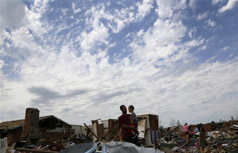 Justin Stephan (L) shows his son Timothy, 3, his tornado-destroyed home for the first time since the storm on 6th Avenue in Moore, Oklahoma Justin Stephan (L) shows his son Timothy, 3, his tornado-destroyed home for the first time since the storm on 6th Avenue in Moore, Oklahoma