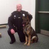Everest Metro Officer Matt Krembs and k9 officer 'Aron' at a press conference, May 23, 2013