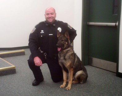 Everest Metro Officer Matt Krembs and k9 officer 'Aron' at a press conference, May 23, 2013 Everest Metro Officer Matt Krembs and k9 officer 'Aron' at a press conference, May 23, 2013