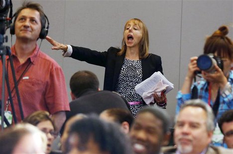 Protester Medea Benjamin, co-founder of the Code Pink activist group, interrupts U.S. President Barack Obama as he speaks about his administ Protester Medea Benjamin, co-founder of the Code Pink activist group, interrupts U.S. President Barack Obama as he speaks about his administ