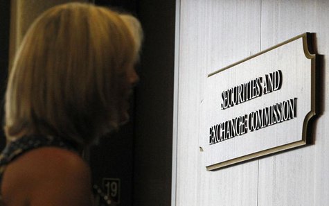 A woman waits for an elevator in the foyer of the Fort Worth Regional Office of the Securities and Exchange Commission (SEC) in Fort Worth, A woman waits for an elevator in the foyer of the Fort Worth Regional Office of the Securities and Exchange Commission (SEC) in Fort Worth,