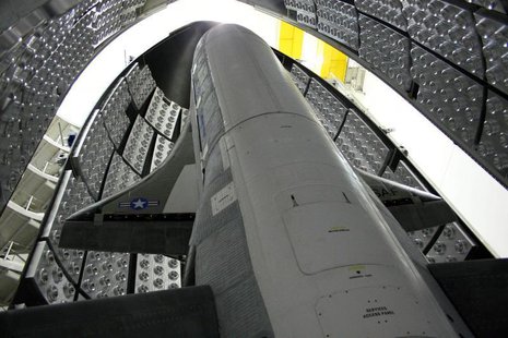 The X-37B Orbital Test Vehicle waits in the encapsulation cell of the Evolved Expendable Launch vehicle at the Astrotech facility in Titusvi The X-37B Orbital Test Vehicle waits in the encapsulation cell of the Evolved Expendable Launch vehicle at the Astrotech facility in Titusvi