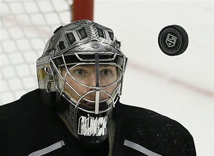 Los Angeles Kings goalie Jonathan Quick keeps his eyes on the puck as he makes a save against the San Jose Sharks in the 2nd period during G Los Angeles Kings goalie Jonathan Quick keeps his eyes on the puck as he makes a save against the San Jose Sharks in the 2nd period during G