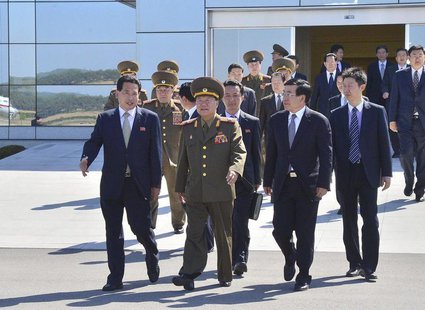 Choe Ryong-hae (C), director of the General Political Bureau of the Korean People's Army (KPA) of North Korea, walks with Chinese Ambassador Choe Ryong-hae (C), director of the General Political Bureau of the Korean People's Army (KPA) of North Korea, walks with Chinese Ambassador