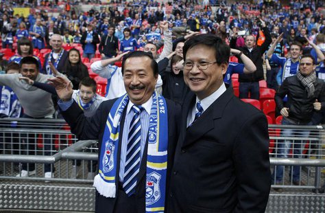 Cardiff City's Malaysian Chairman Chan Tien Ghee (R) and Malaysian owner Vincent Tan smile ahead of their English League Cup final soccer ma Cardiff City's Malaysian Chairman Chan Tien Ghee (R) and Malaysian owner Vincent Tan smile ahead of their English League Cup final soccer ma