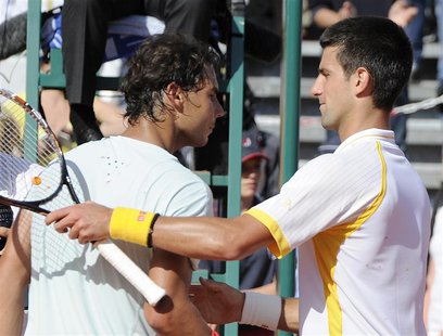 Novak Djokovic of Serbia (R) shakes hand with Rafael Nadal of Spain after the final match of the Monte Carlo Masters in Monaco April 21, 201 Novak Djokovic of Serbia (R) shakes hand with Rafael Nadal of Spain after the final match of the Monte Carlo Masters in Monaco April 21, 201