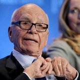 Chairman and CEO of News Corporation Rupert Murdoch talks next to Laurene Powell Jobs (R), founder of Emerson Collective and widow of the la