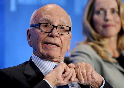 Chairman and CEO of News Corporation Rupert Murdoch talks next to Laurene Powell Jobs (R), founder of Emerson Collective and widow of the la Chairman and CEO of News Corporation Rupert Murdoch talks next to Laurene Powell Jobs (R), founder of Emerson Collective and widow of the la