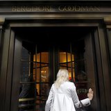 A woman enters high-end retail store Bergdorf Goodman along 5th Avenue in New York May 19, 2013. REUTERS/Eric Thayer