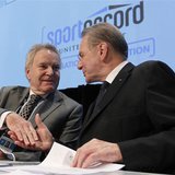 International Olympic Committee (IOC) President Jacques Rogge (R) shakes hands with IOC executive Denis Oswald during an IOC executive board