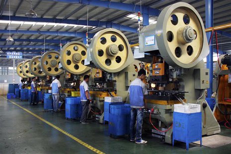 Employees work inside a factory which makes bearing cages in Liaocheng, Shandong province May 24, 2013. REUTERS/Stringer Employees work inside a factory which makes bearing cages in Liaocheng, Shandong province May 24, 2013. REUTERS/Stringer