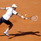 Novak Djokovic of Serbia hits a return to Tomas Berdych of Czech Republic during their men's singles quarter final match at the Rome Masters