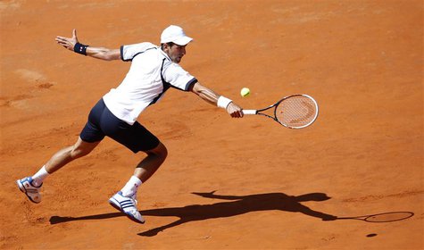 Novak Djokovic of Serbia hits a return to Tomas Berdych of Czech Republic during their men's singles quarter final match at the Rome Masters Novak Djokovic of Serbia hits a return to Tomas Berdych of Czech Republic during their men's singles quarter final match at the Rome Masters