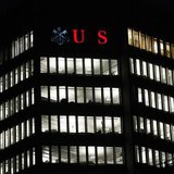 A partially illuminated logo of Swiss bank UBS is seen on a building in Zurich December 18, 2012. REUTERS/Michael Buholzer