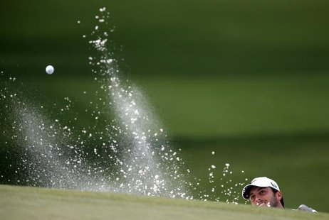 Francesco Molinari of Italy hits from a sand trap in the seventh hole during first round play in the 2013 Masters golf tournament at the Aug Francesco Molinari of Italy hits from a sand trap in the seventh hole during first round play in the 2013 Masters golf tournament at the Aug