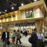 Attendees pass by the General Growth Properties booth during the International Council of Shopping Centers convention in Las Vegas, May 18, 