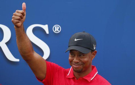 Tiger Woods reacts after being presented with The Players Championship trophy after winning the PGA golf tournament at TPC Sawgrass in Ponte Tiger Woods reacts after being presented with The Players Championship trophy after winning the PGA golf tournament at TPC Sawgrass in Ponte
