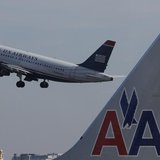 A U.S. Airways jet departs Washington's Reagan National Airport next to an American Airlines jet outside Washington, February 25, 2013. REUT A U.S. Airways jet departs Washington's Reagan National Airport next to an American Airlines jet outside Washington, February 25, 2013. REUT