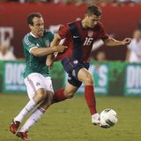 U.S. midfielder Robbie Rogers (16) is pulled down by Mexico defender Gerardo Torrado during the second half of their friendly soccer match i U.S. midfielder Robbie Rogers (16) is pulled down by Mexico defender Gerardo Torrado during the second half of their friendly soccer match i