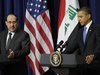 Iraq's Prime Minister Nuri al-Maliki (L) and U.S. President Barack Obama (R) hold a joint news conference in the Eisenhower Executive Office