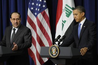 Iraq's Prime Minister Nuri al-Maliki (L) and U.S. President Barack Obama (R) hold a joint news conference in the Eisenhower Executive Office