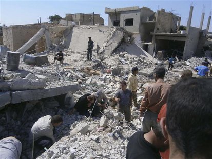 Civilians search for survivors under rubble after what activists said was shelling by forces loyal to Syria's President Bashar al-Assad, in Civilians search for survivors under rubble after what activists said was shelling by forces loyal to Syria's President Bashar al-Assad, in