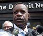 Detroit's emergency financial manager Kevyn Orr talks to members of the media outside the Detroit Newspapers building about the report he de